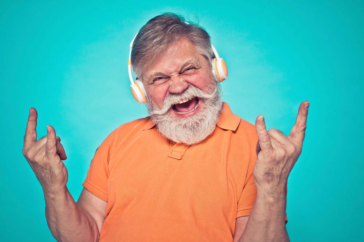 Funny Hipster Senior Man Modeling during a Photoshooting.